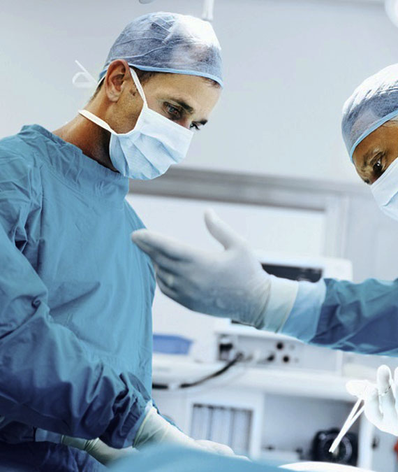 Two male surgeons in the OR and one of them is asking for a tool